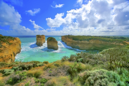 ISLAND COAST - ocean, clouds, water, green, plants, rocks, cliffs