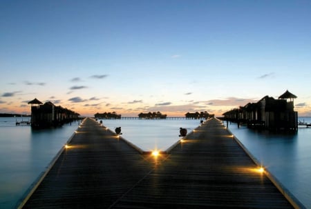 Sunset Pier......... - lights, beach, islands, lit, ocean, villa, pier, walkway, sunset, exotic, paradise, tropical, villas, water, evening, blue, lagoon, dusk, island, bungalows, sea