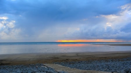 wooden walkway over stones on a beach - clouds, beach, stones, sundown, walkway, sea