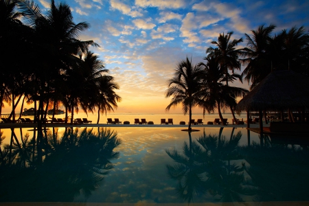 Beach Sunset over Pool - sky, beach, paradise, sun, sunset, polynesia, orange, down, replection, sand, dusk, ocean, swimming, islands, tropical, exotic, skies, island, fiji, south pacific, pool, sea