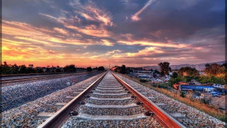 straight train tracks entering a city hdr - junk yards, clouds, tracks, sunset, hdr, pebbles