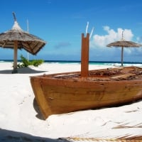 Boat on White Sand Beach