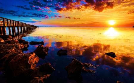 Pier at Sunset - clouds, sea, reflection, rocks, sun, sky