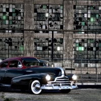 vintage chevrolet at an abandoned warehouse