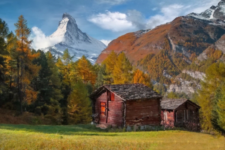 Mountain cottage - hills, cabin, landscape, grass, mountain, peak, cliffs, nice, hut, cottage, sky, falling, house, mountainscape, trees, beautiful, snowy, colors, lovely, village, fall, wooden, nature, autumn, peaceful, foliage, rocks