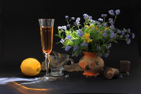 Forget me not - yellow, blue, dark, flowers, fruits, vase, abstract, brautiful, beautiful, photography, table, small, simple, colors, freshness, still life, drink, black, forget me not, background, glass, lemon