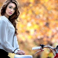 gorgeous brunette with bicycle