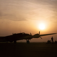 Sunset silhouette of a B-17 flying fortress