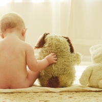 Child and teddy bear