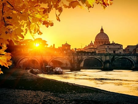 View at Tiber and Saint Peter's cathedral in Rome, Italy - roma, leaves, view, river, light, golden, cathedral, pier, tree, sunset, italy, shine, glow, water, rays, branches, dock, sunlight, orange, boats, sunrise, dazzling