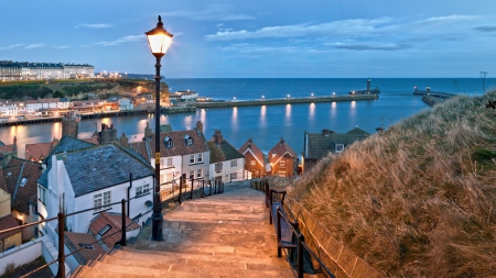 evening on the lovely town of whitby in england - hill, town, lights, evening, harbor