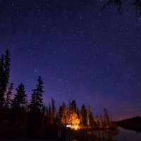 campfire under gorgeous stars at roche lake canada