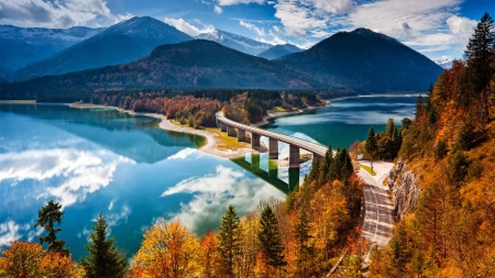 Autumn in Bavaria Germany - clouds, trees, Autumn, water, Germany, Fall, road, Sylvenstein Lake, reflection, Bavaria, Bavaria Germany, lake, mountains, bridge