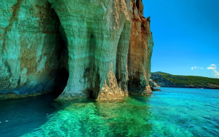 wonderful green caves in sea cliff