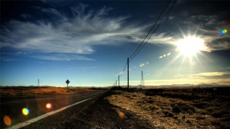 midday sun over highway through the prairie - sky, sun, beams, highway, prairie, electric line