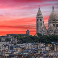 cathedral on a hill in paris at sunset