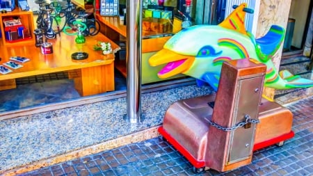 a dolphin ride in front of a smoke shop hdr - ride, sidewalk, store, hdr, front, dolphin