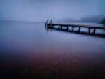 wonderful pier on a misty lake