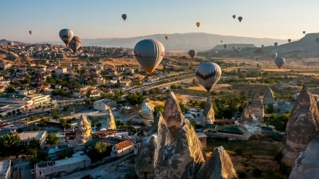 hot air balloons over a turkish town - mountains, balloons, town, rocks