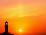 lighthouse and com antenna in glorious sunset