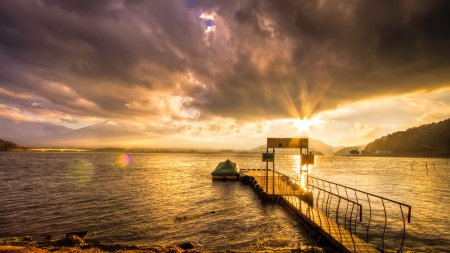 magnificent sunset over a lake - clouds, sunset, rays, boat, lake, dock