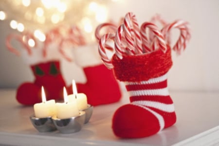 The stocking of the candies - christmas, happy holiday, candies, candles, new years, stocking, santa claus, sugar