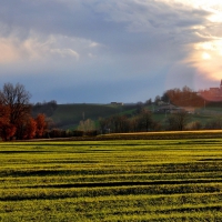 sun rays on a church on a rural hill