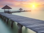 gazebos on a pier on a misty sea