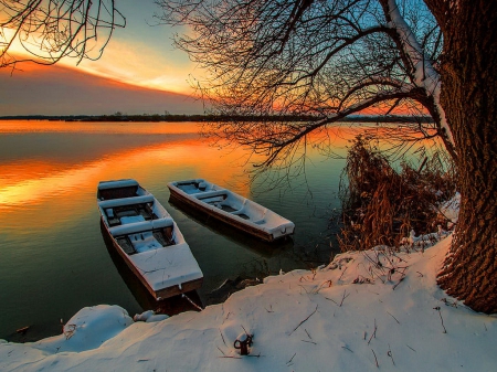 In safe harbor - nice, sky, trees, sunset, calm, painting, art, quiet, pretty, reflection, cold, boat, safe, ice, branches, lake, boats, harbor, winter, shore, place, lovely, serenity, nature, fiery, frost, snow, beautiful