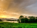 fog over fields at sunrise hdr