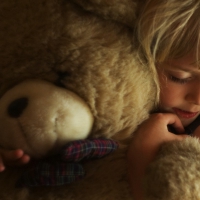 Girl and teddy bear