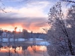 sunset reflected on a lake in winter