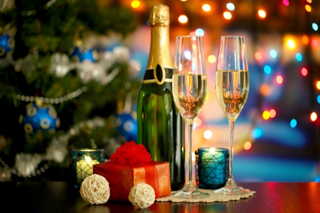 We toast a New Year - to toast, decorationi, attended, bottle, candle, tree, champagne, lights, wine glasses, gift, atmosphere