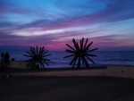 Malecon statues at sunset