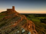 castle ruins on a hill at sunrise