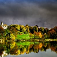 lakeside palace under stormy skies