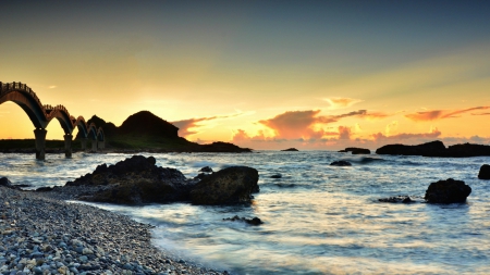 dragon bridge to a rocky island - beach, island, stones, sunset, sea, bridge, rocks