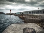 lighthouse at the end of a wharf