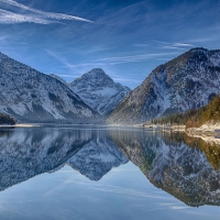 mirrored lake plansee in the austrian tyrols