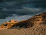 old castle on a sea coast under stormy sky