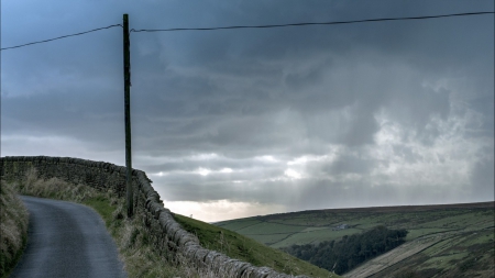 stone wall along a hill road hdr - hill, clouds, hdr, road, stones, wall, electric pole