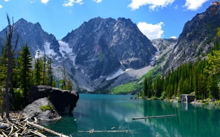 The enchantments - calm, quiet, hills, blue, majestic, landscape, reflection, mountain, shore, lake, nice, emerald, sky, woods, clouds, trees, water, beautiful, mirrored, slope, enchantment, lovely, peaks, serenity, rocks