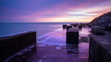 wavebreaker blocks on seashore - shore, suset, sea, pink, blocks