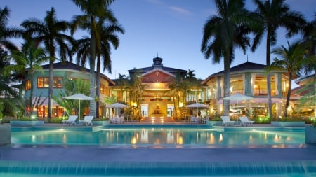 beautiful resort in the maldives at dusk - palms, pool, lights, dusk, resort