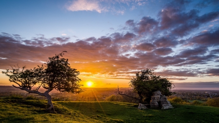 fabulous sunset - rocks, clouds, rays, hills, trees, sunset