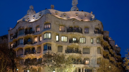 a marvelous apartment building by antoni gaudi - lights, artistic, building, evening, apartments