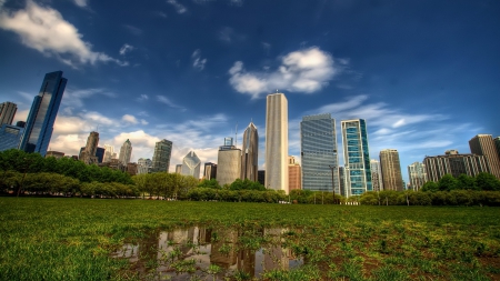 city reflected in a puddle - skyscrapers, city, lawn, reflection, sky, puddle