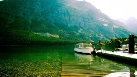 On the Lake - lake, sky, mountain, trees, dock, water, rocks, nature, forest, reflection, green, grass, boat