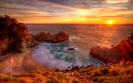 Shore at sunrise - sky, water, rocks, view, amazing, river, clouds, grass, rays, lake, shore, lovely, waves, glow, beautiful, dawn, sunrise, sea, splash