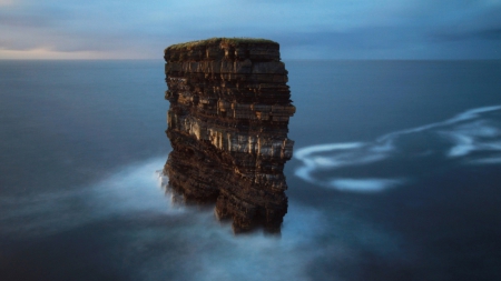 layered rock island at sea - island, layers, grass, sea, rocks, mist